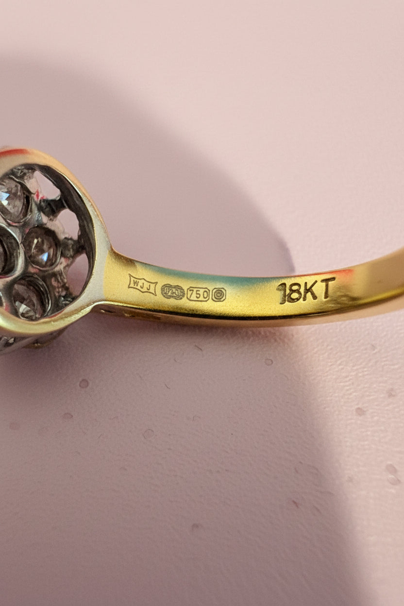 Gold ring with full UK Hallmarks and '18KT' stamped onto the gold