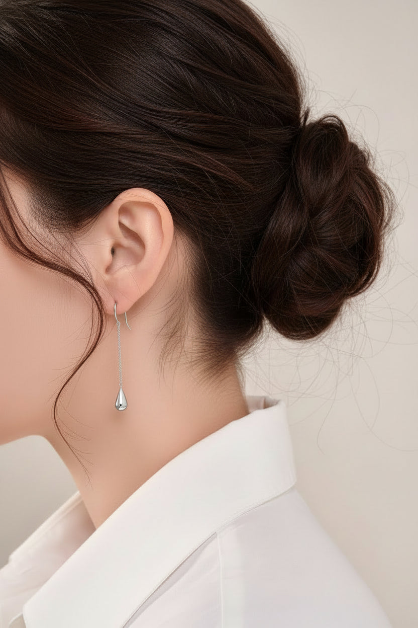 Close-up of Elsa Peretti Tiffany & Co earring in an ear.